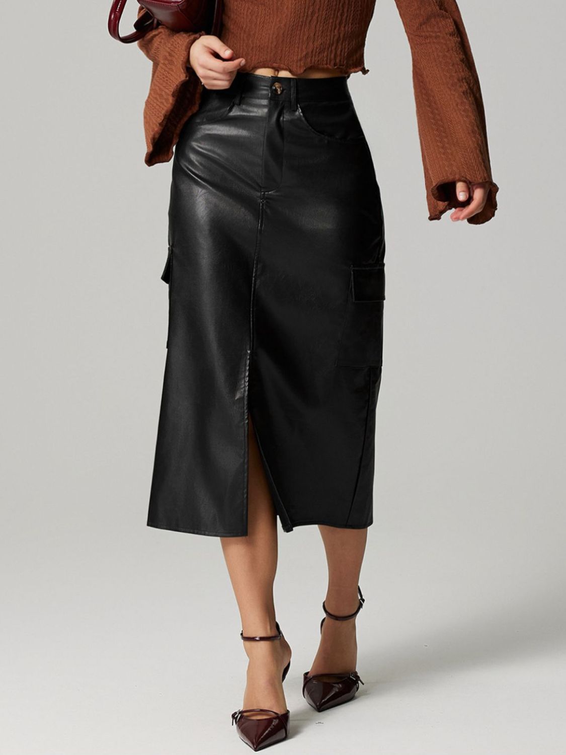 Lily slit midi skirt with pockets in black by Pinup Girl Clothing.