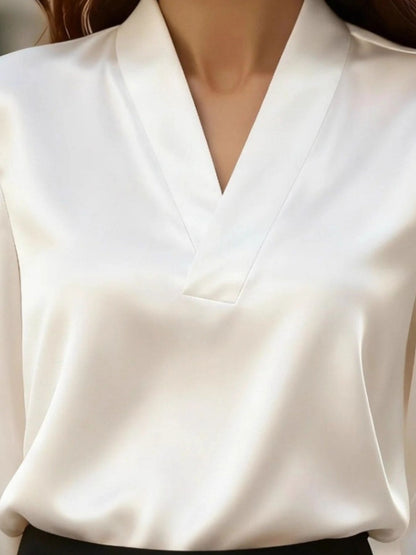 The Vintage Noir V-neck satin blouse by Pinup Girl Clothing, sizes XS to 4X.