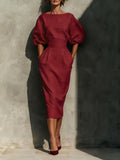 Puff-sleeve pencil midi dress in wine red by Pinup Girl Clothing, with pockets.