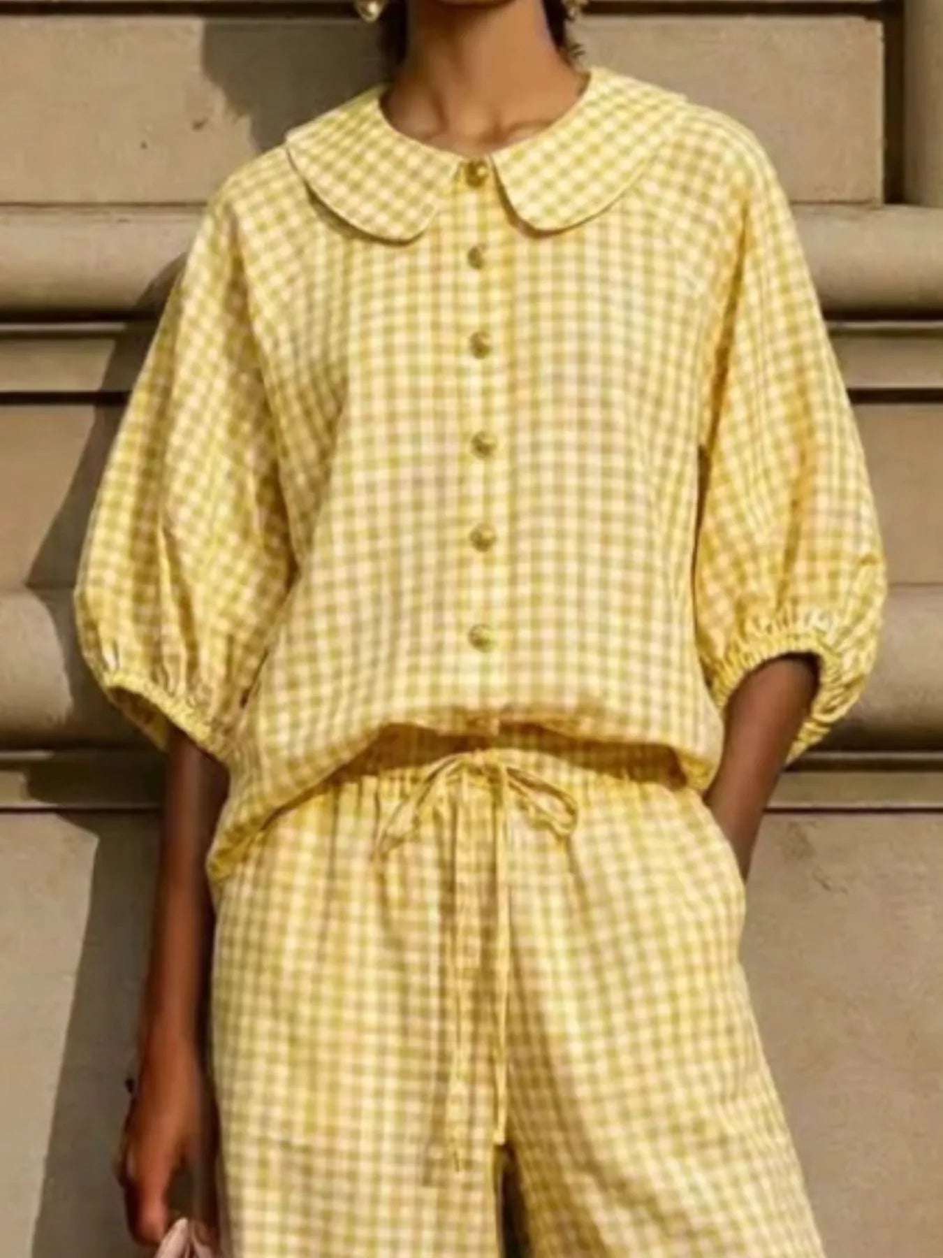 Bettina gingham set styled with flats and a shoulder bag, by Pinup Girl Clothing