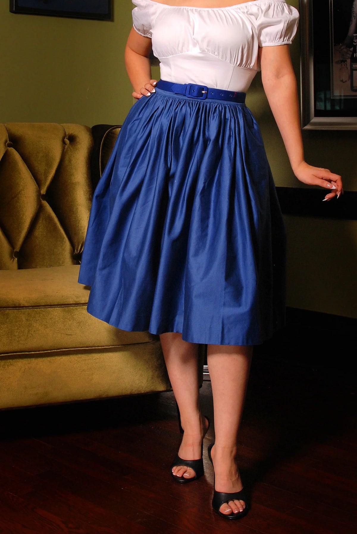 Waist-down view of the Bella swing skirt in royal blue sateen with black sandals