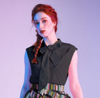 Black Bow Top, a 1950s sleeveless cotton blouse with an oversized neck bow