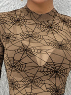 Close-up of the khaki mesh mock neck with black spiderweb print