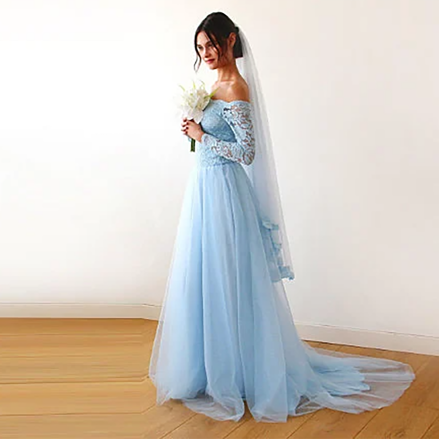 Light blue tulle veil from behind showing the lace trimmed edge