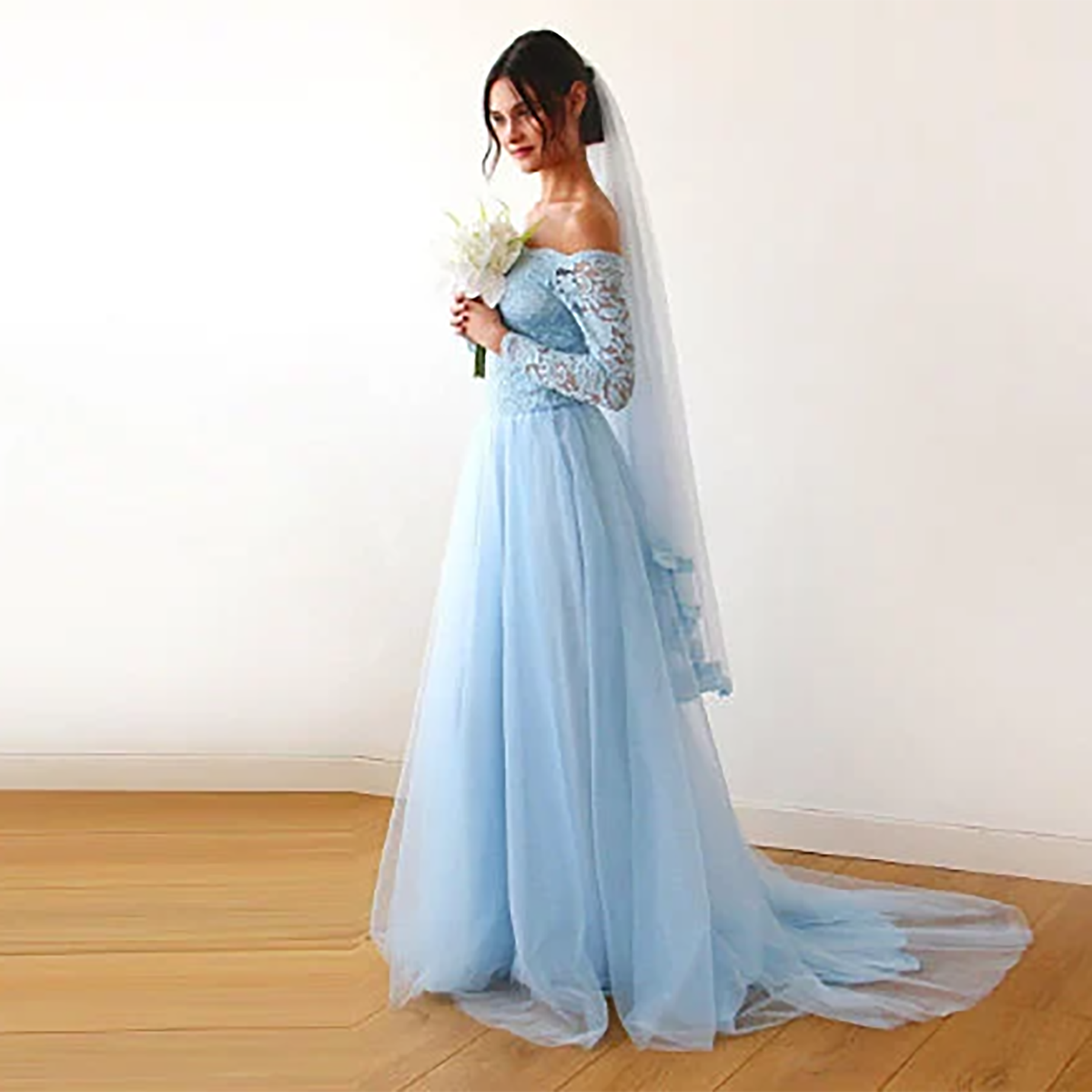 Light blue tulle veil from behind showing the lace trimmed edge