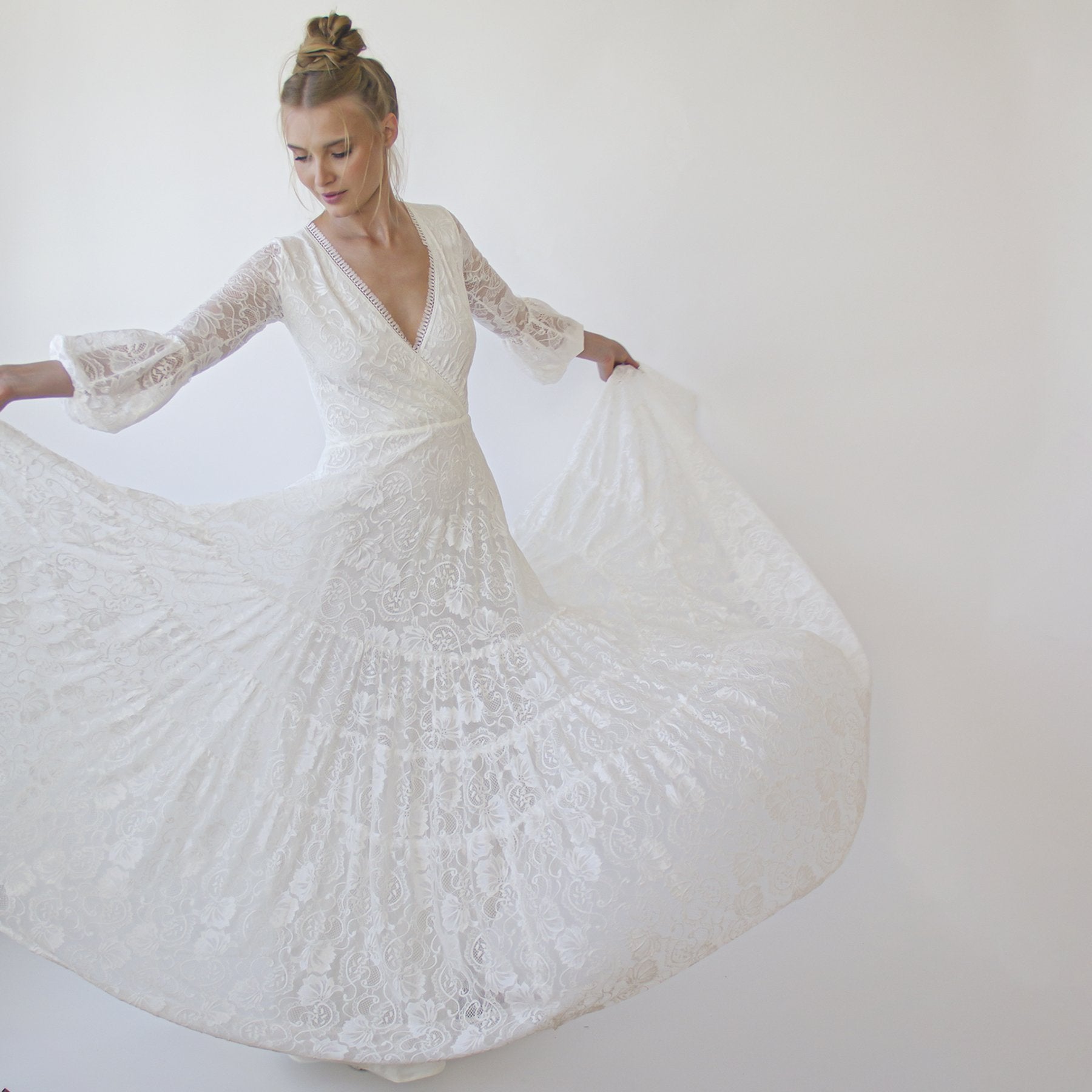 Juniper ivory lace wrap gown shown full length on the model