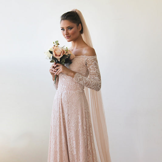 Blush tulle bridal veil from behind showing the floor-length drape