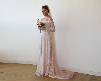 Blush tulle bridal veil styled with an updo
