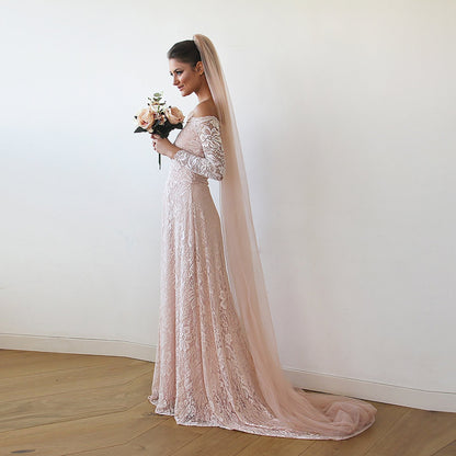 Blush cathedral length tulle bridal veil shown full length on the model