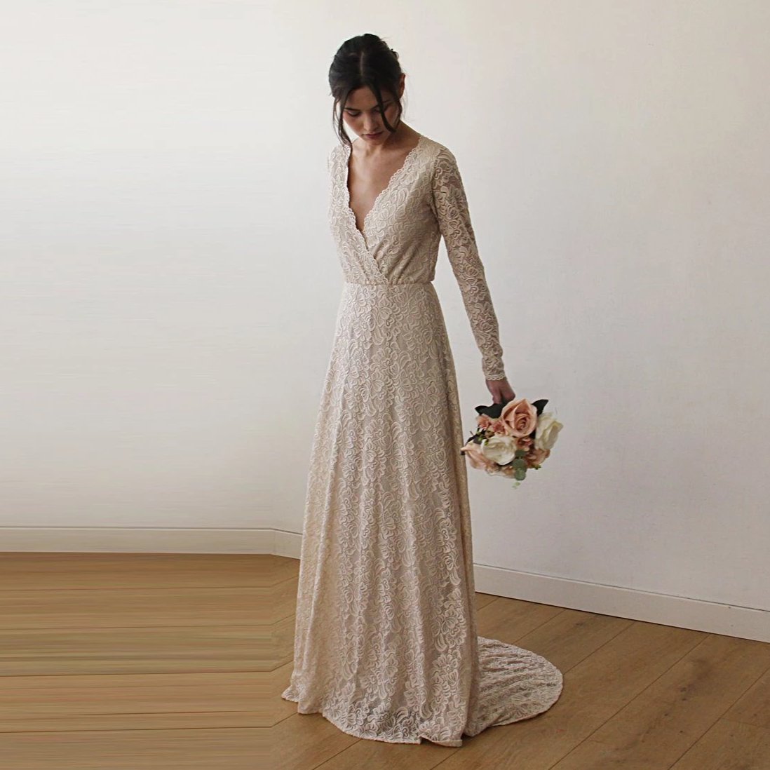 Detail of the Colette champagne gown deep V wrap neckline