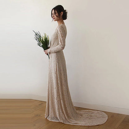 Colette champagne lace gown shown full length on the model