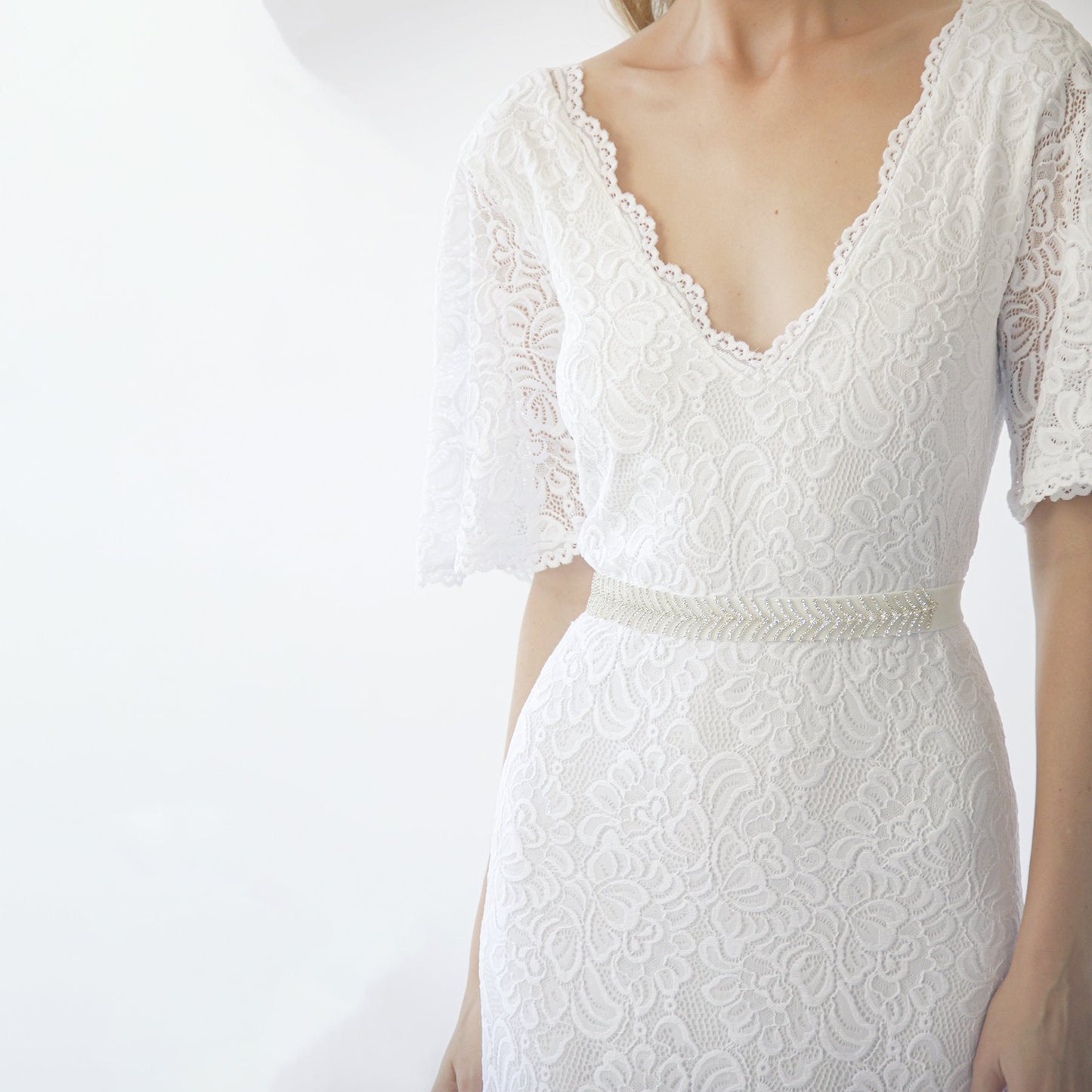 Back view of the Delphine ivory gown showing the V neckline at the back