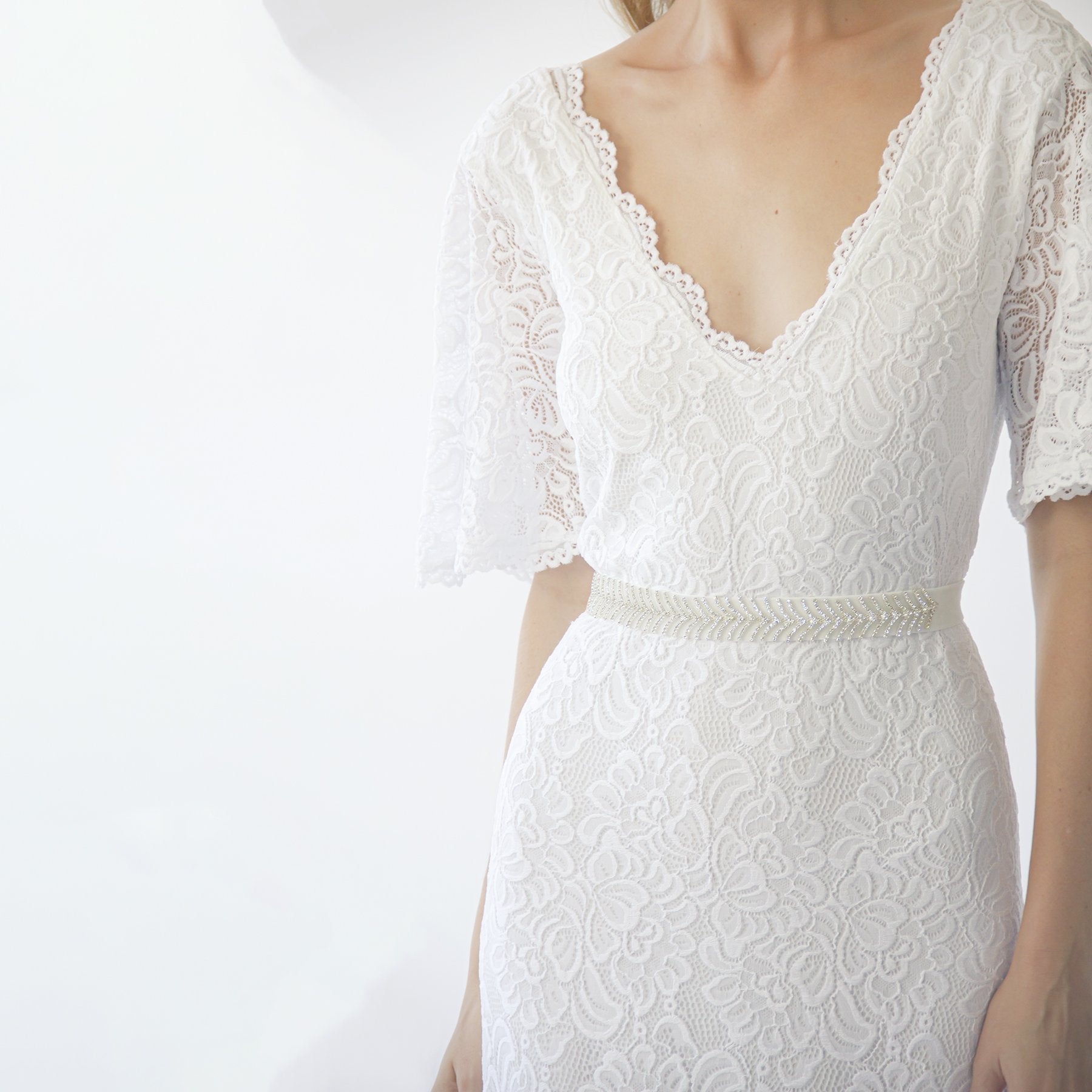 Back view of the Delphine ivory gown showing the V neckline at the back