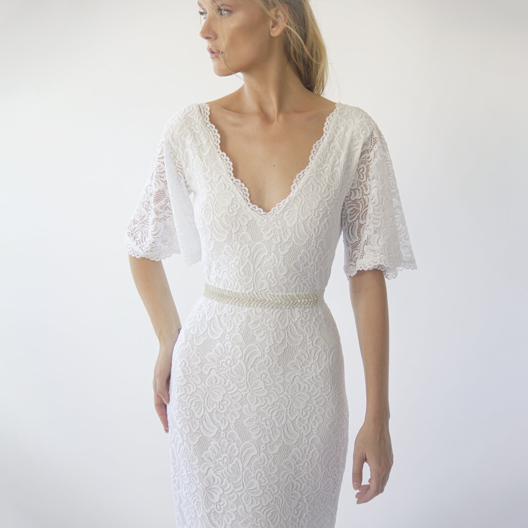 Detail of the Delphine ivory gown butterfly lace sleeve