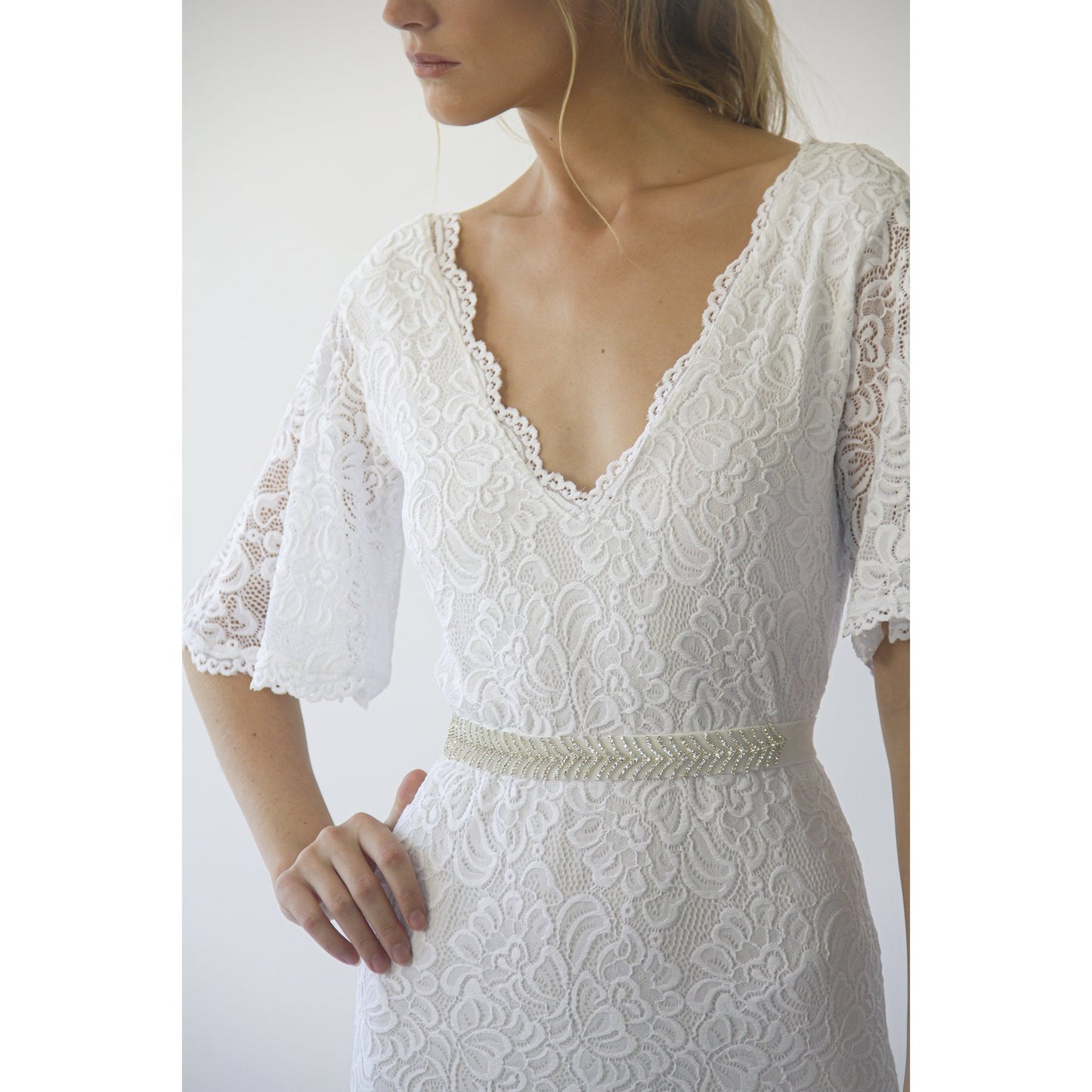 Delphine ivory lace sheath gown shown full length on the model