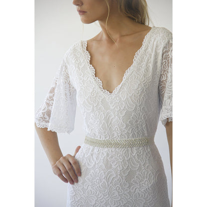 Delphine ivory lace sheath gown shown full length on the model