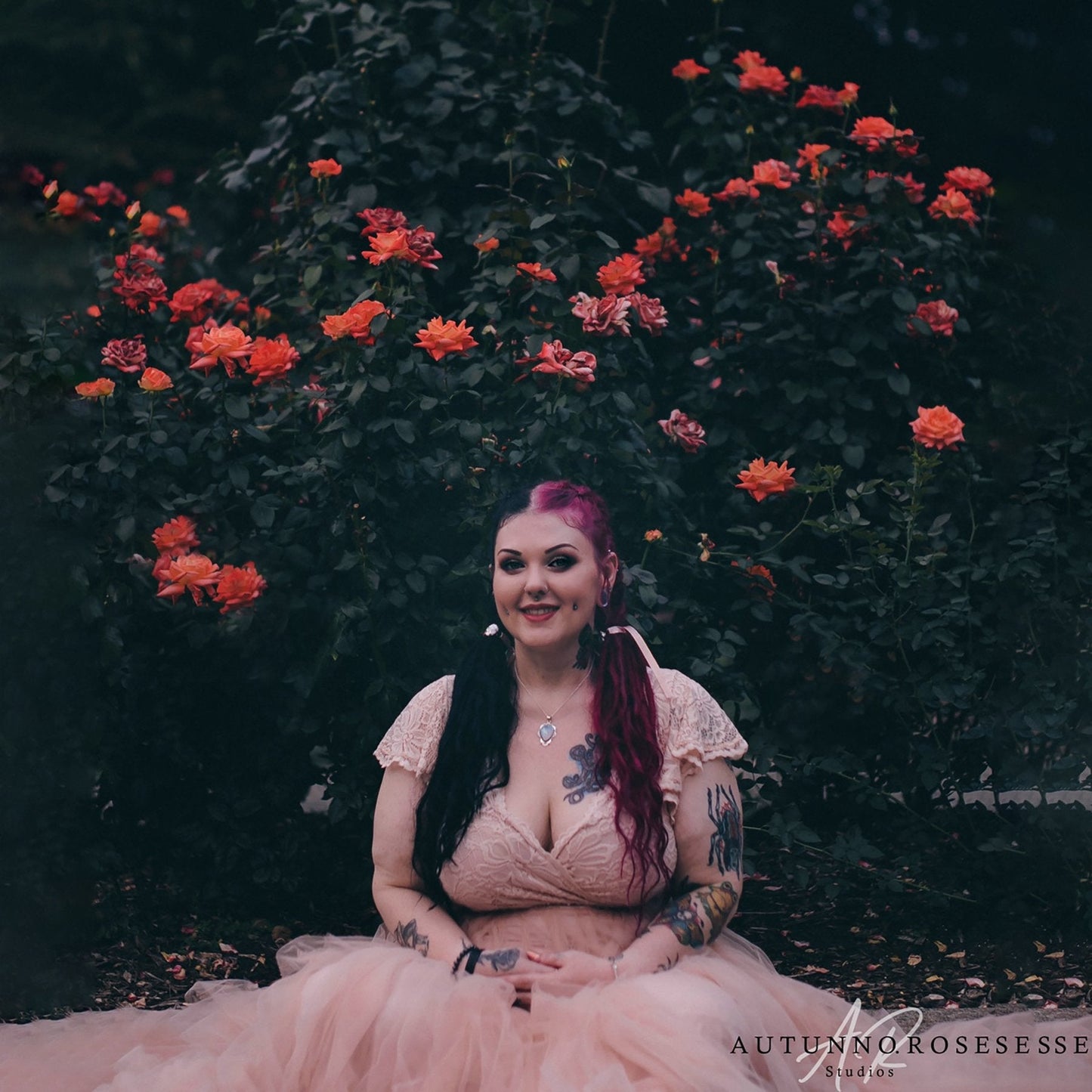 Model in the Seraphine blush lace wrap gown with V neckline, circular cap sleeves and tulle cathedral train