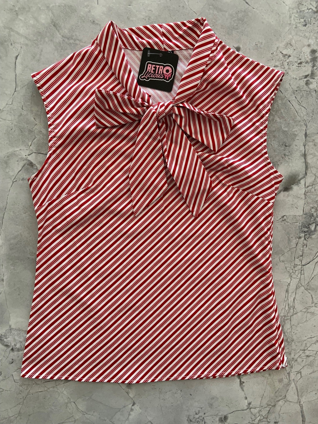 Candy Cane Stripe Bow Top in red and white diagonal stripes with an oversized neck bow