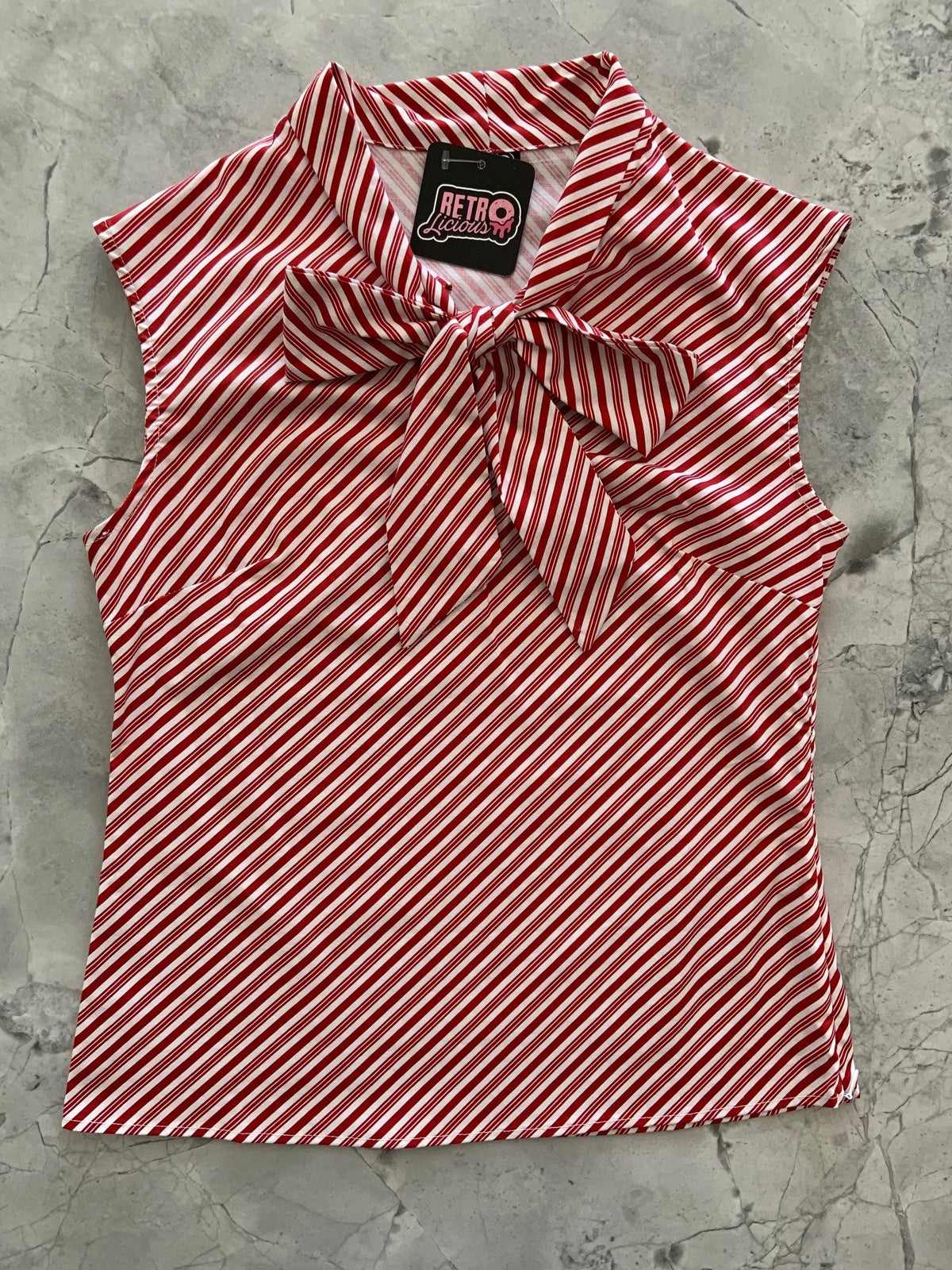 Candy Cane Stripe Bow Top in red and white diagonal stripes with an oversized neck bow