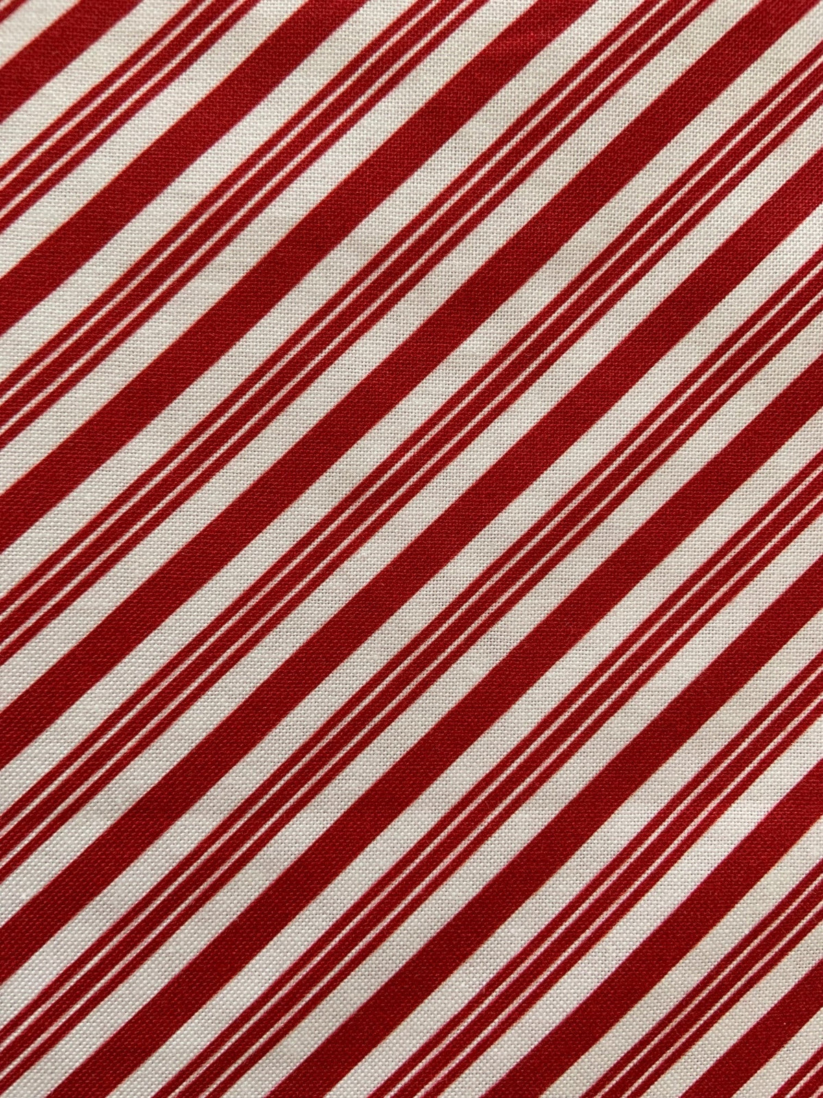 Candy Cane Stripe Bow Top in red and white diagonal stripes with an oversized neck bow