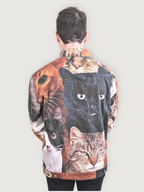 Back view of the Cat Wrangler Denim Jacket showing the cat face collage print