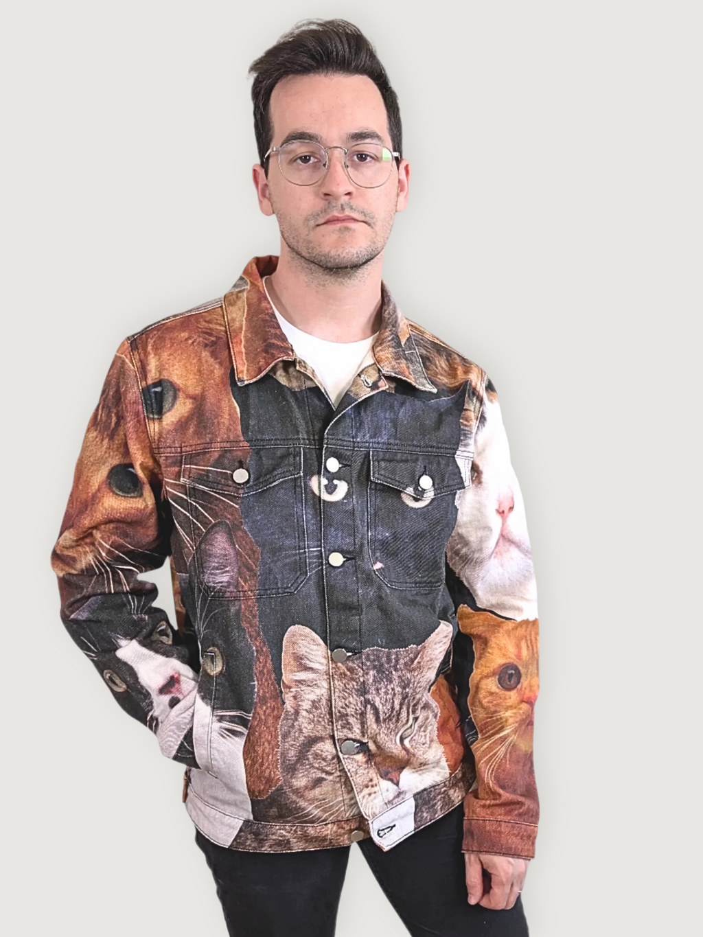 Front view of the Cat Wrangler Denim Jacket buttoned up, tabby cat face at the hem