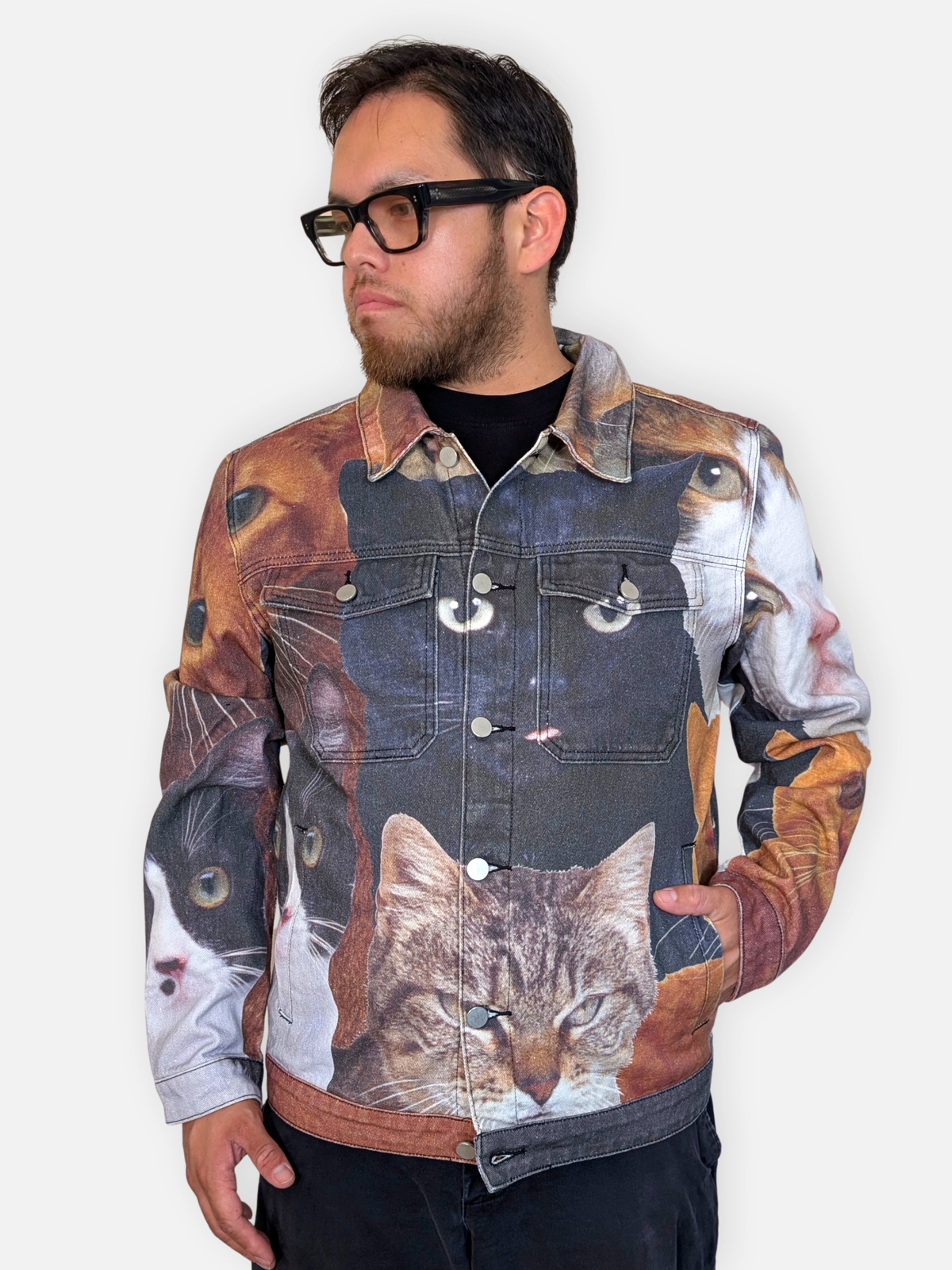 Cat Wrangler Denim Jacket worn open over a black tee, three-quarter view