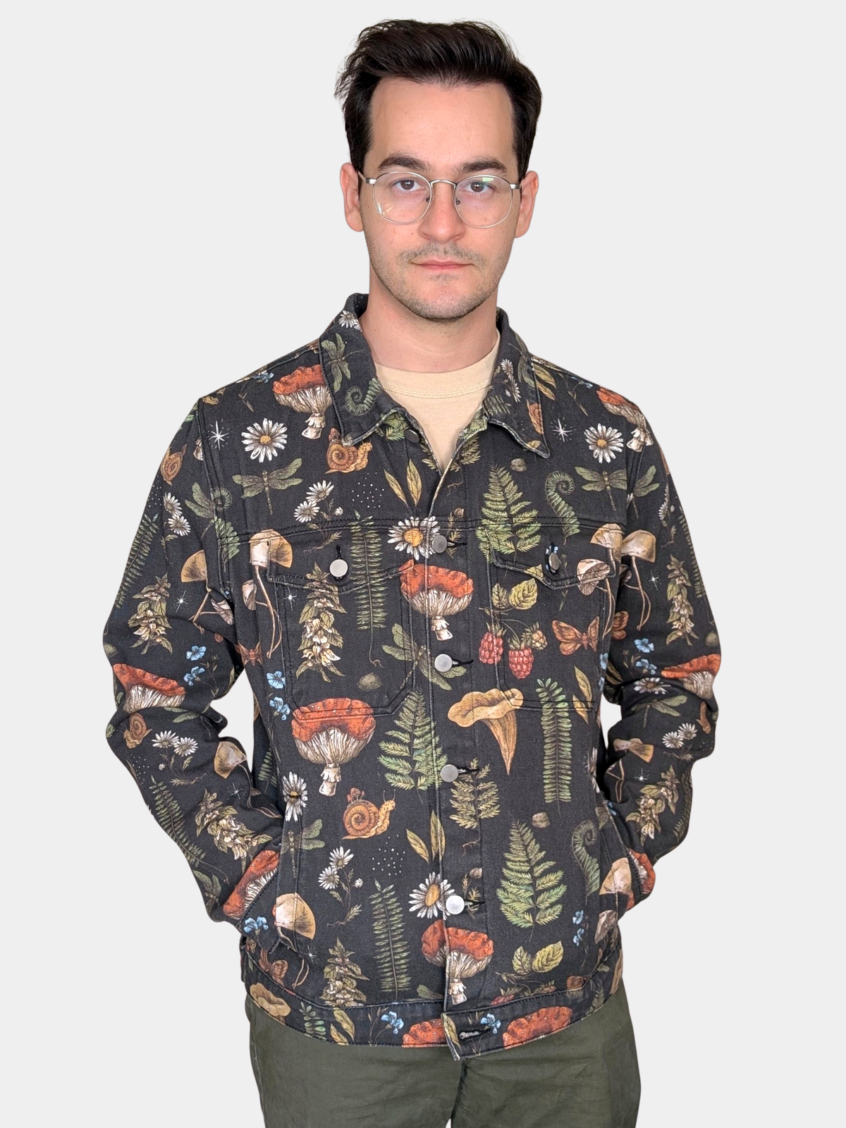 Cottagecore Essentials Denim Jacket worn buttoned with hands at the front pockets, black botanical print denim