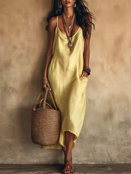 Marlowe satin slip midi dress with pockets in yellow by Pinup Girl Clothing