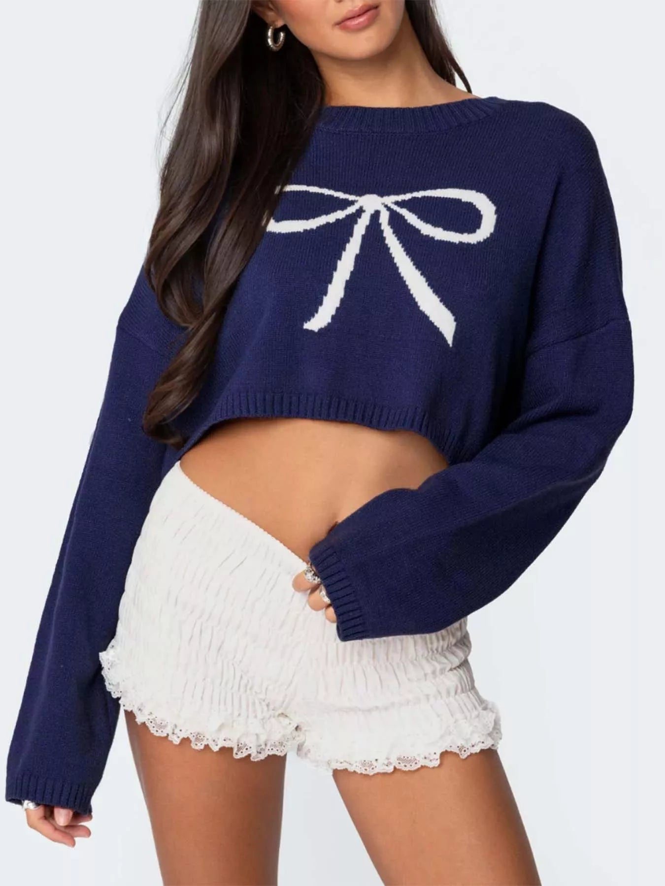 Bow Peep cropped sweater in navy blue with a white bow by Pinup Girl Clothing