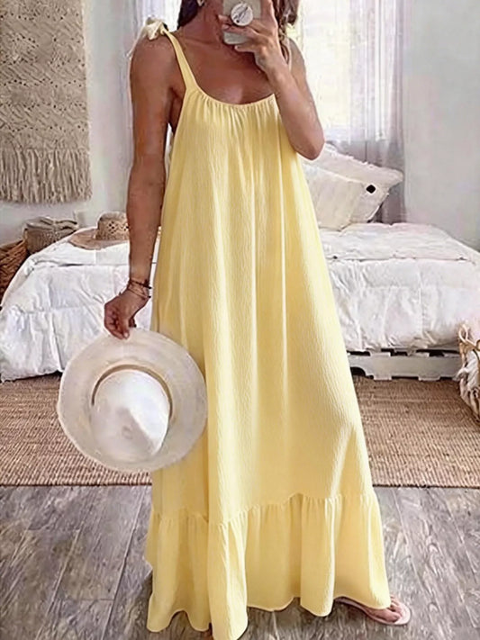 Tie-strap flowy maxi dress in yellow by Pinup Girl Clothing.