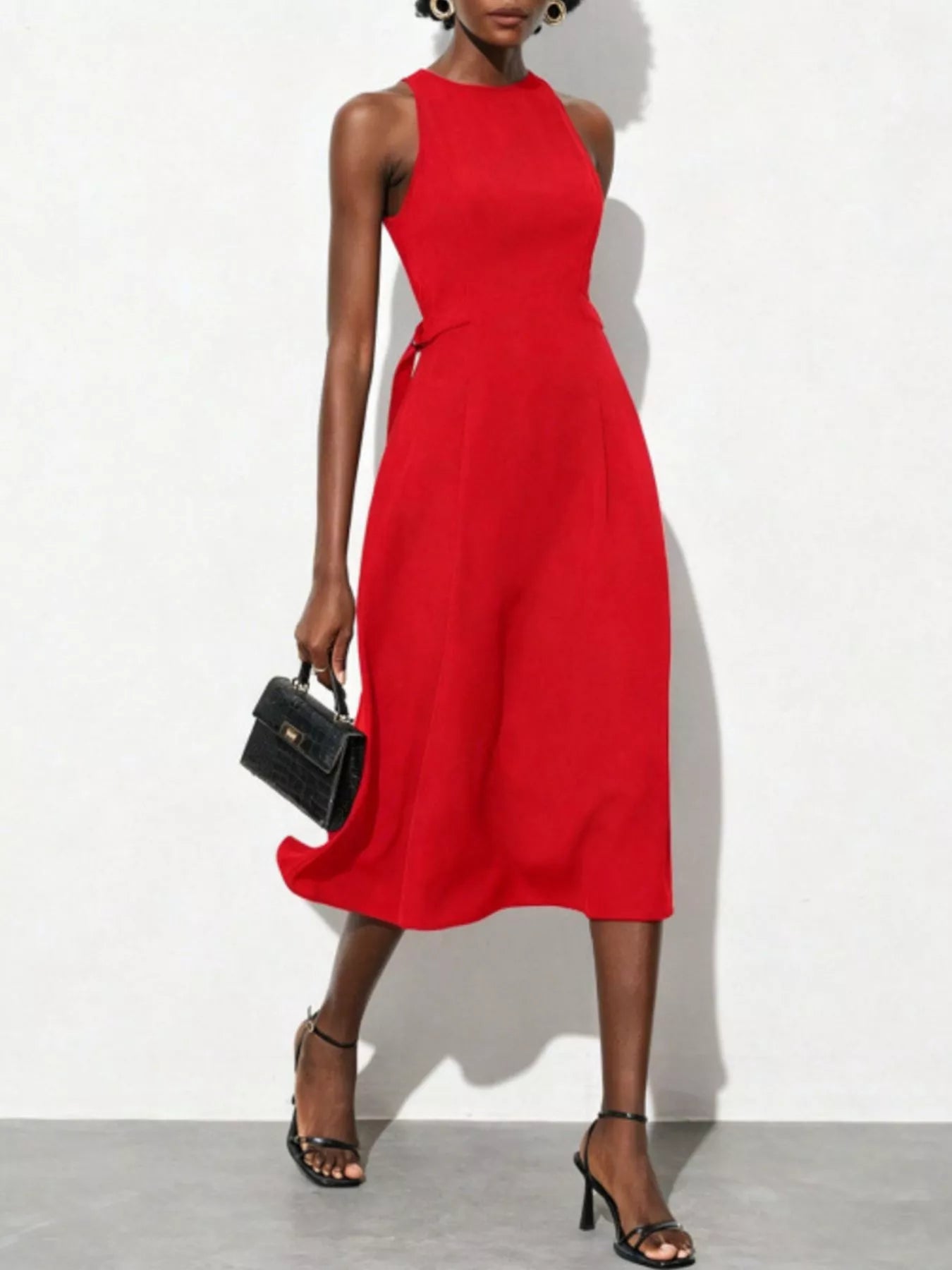 Sleeveless midi dress by Pinup Girl Clothing, in red, sizes XS to XL.