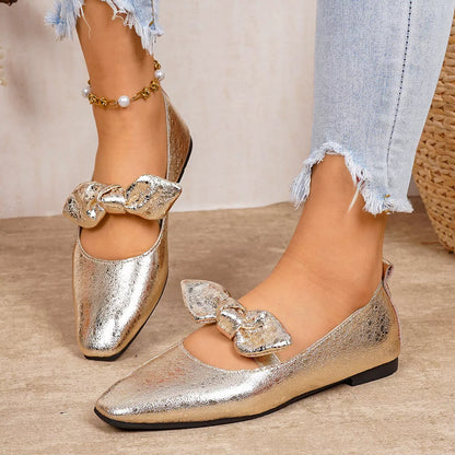 Bow square-toe slip-on flats in gold by Pinup Girl Clothing.