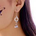 Skull and lantern dangle earrings in silver by Pinup Girl Clothing