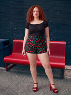The Gathered Peasant Top in black stretch cotton sateen, on or off the shoulder, by Pinup Girl Clothing.