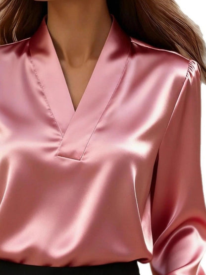 The Vintage Noir V-neck satin blouse by Pinup Girl Clothing, sizes XS to 4X.