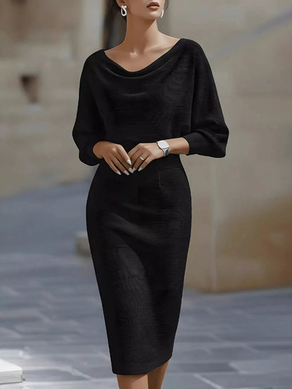 Model in the Silver Screen cowl-neck knit bodycon dress in black, by Pinup Girl Clothing