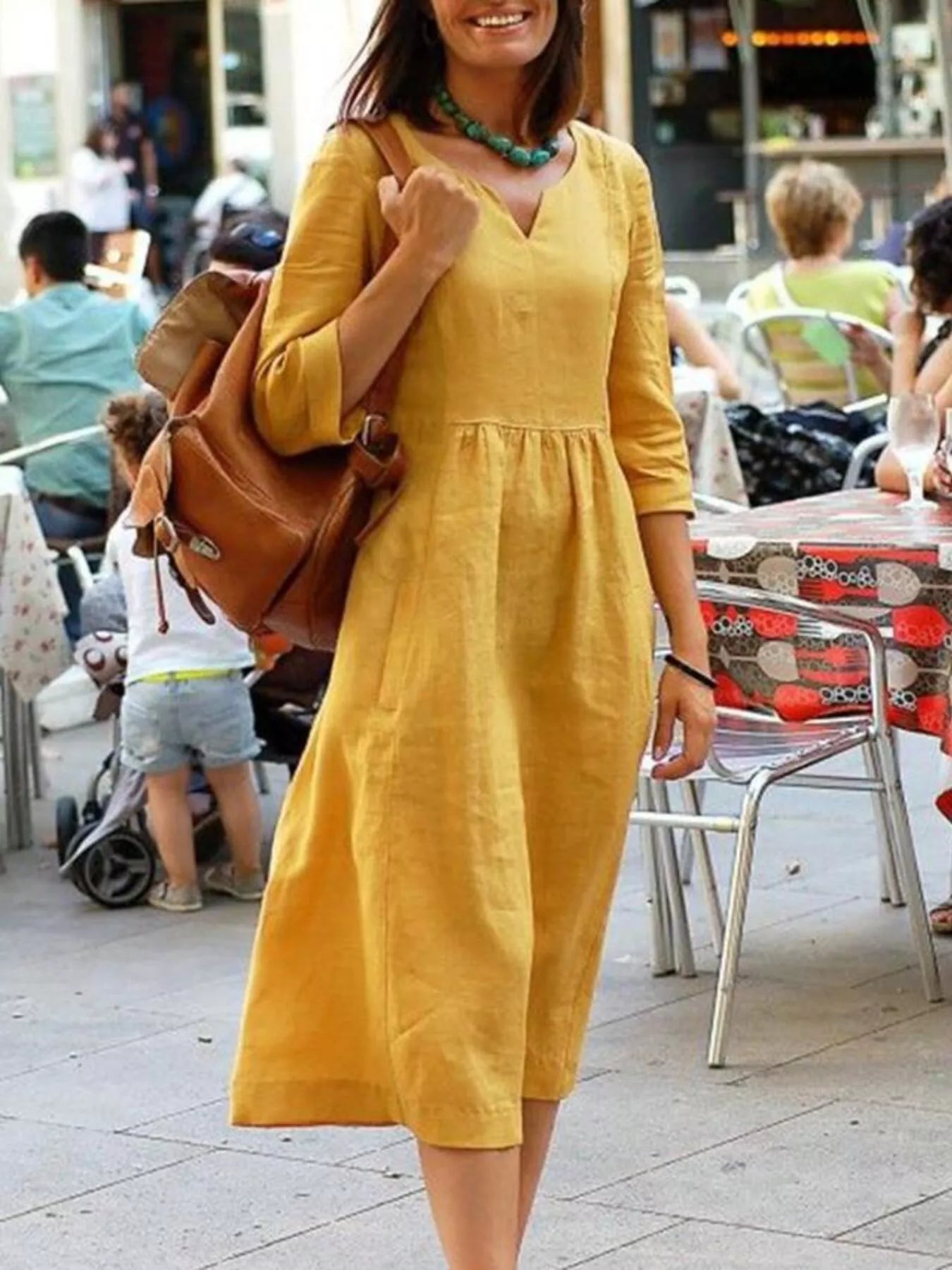 Giulia notched neck cotton midi swing dress with pockets in yellow by Pinup Girl Clothing