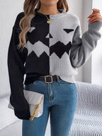 Carved two-tone pumpkin face sweater in black and gray
