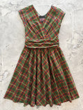 Green Plaid Greta Dress, a green and red plaid 1950s swing dress with a surplice neckline