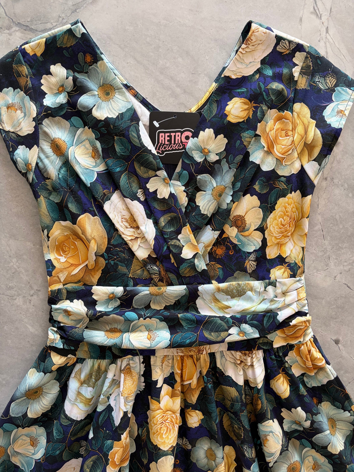 Midnight Floral Greta Dress, a black floral 1950s swing dress with a surplice neckline