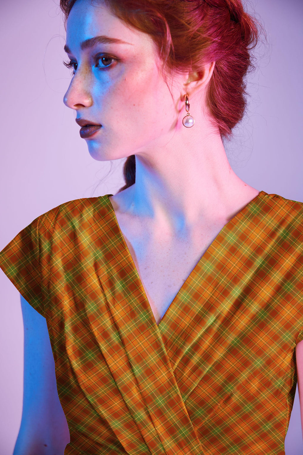 Orange Plaid Greta Dress, a 1950s cotton swing dress with a surplice neckline and gathered waist