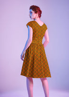 Orange Plaid Greta Dress, a 1950s cotton swing dress with a surplice neckline and gathered waist