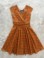 Orange Plaid Greta Dress, a 1950s cotton swing dress with a surplice neckline and gathered waist