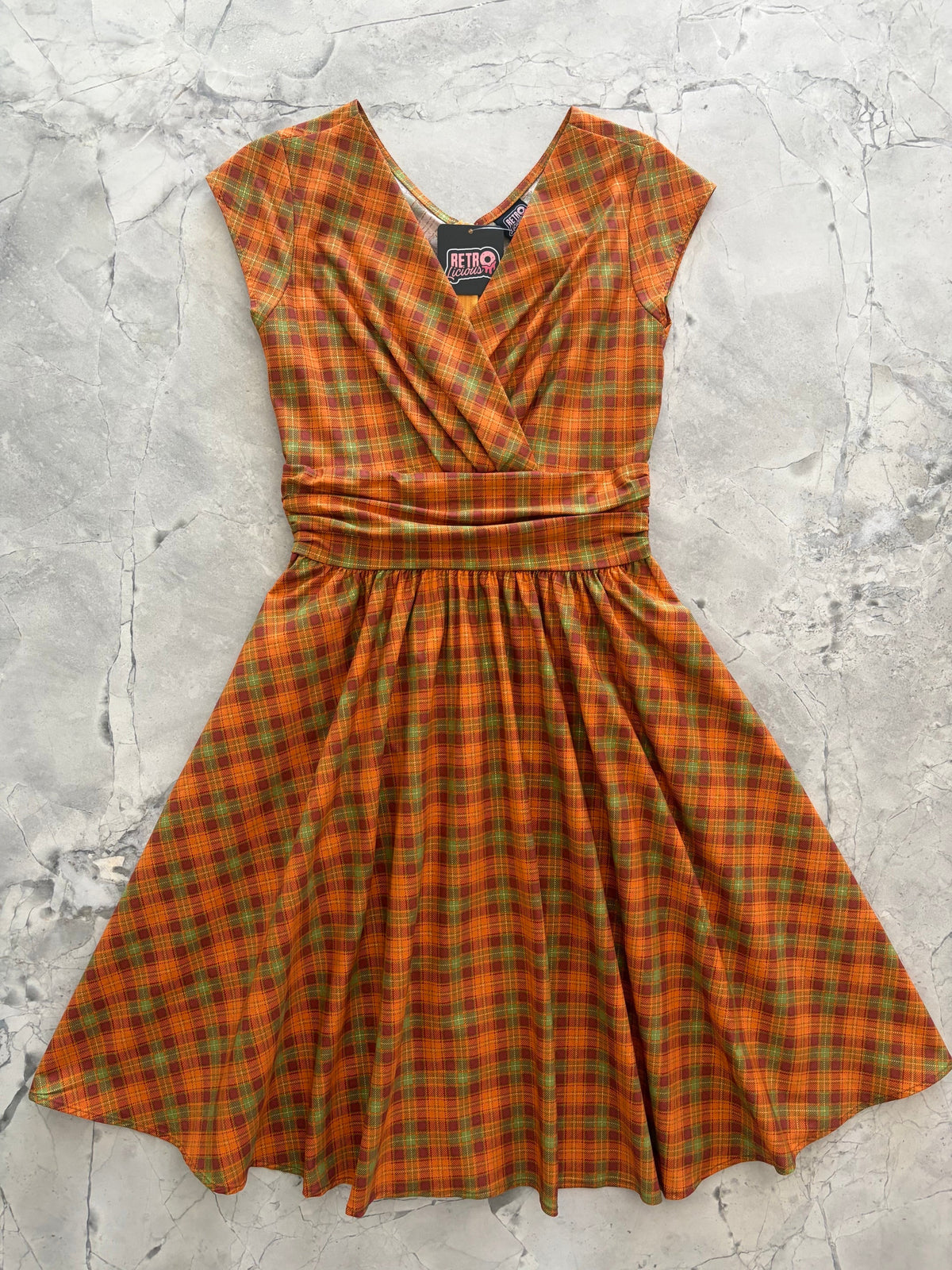 Orange Plaid Greta Dress, a 1950s cotton swing dress with a surplice neckline and gathered waist
