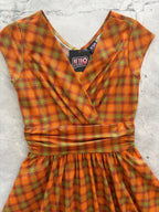 Orange Plaid Greta Dress, a 1950s cotton swing dress with a surplice neckline and gathered waist