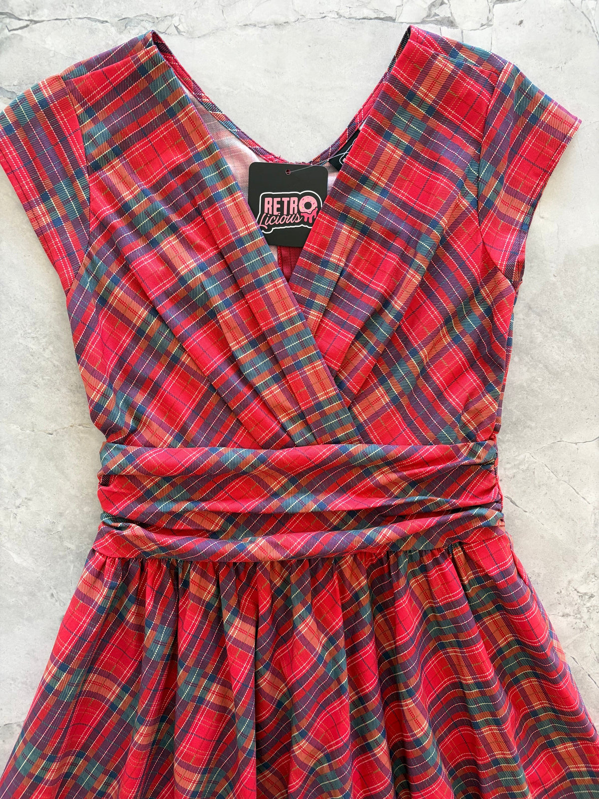 Red Plaid Greta Dress, a 1950s cotton swing dress with a surplice neckline and gathered waist