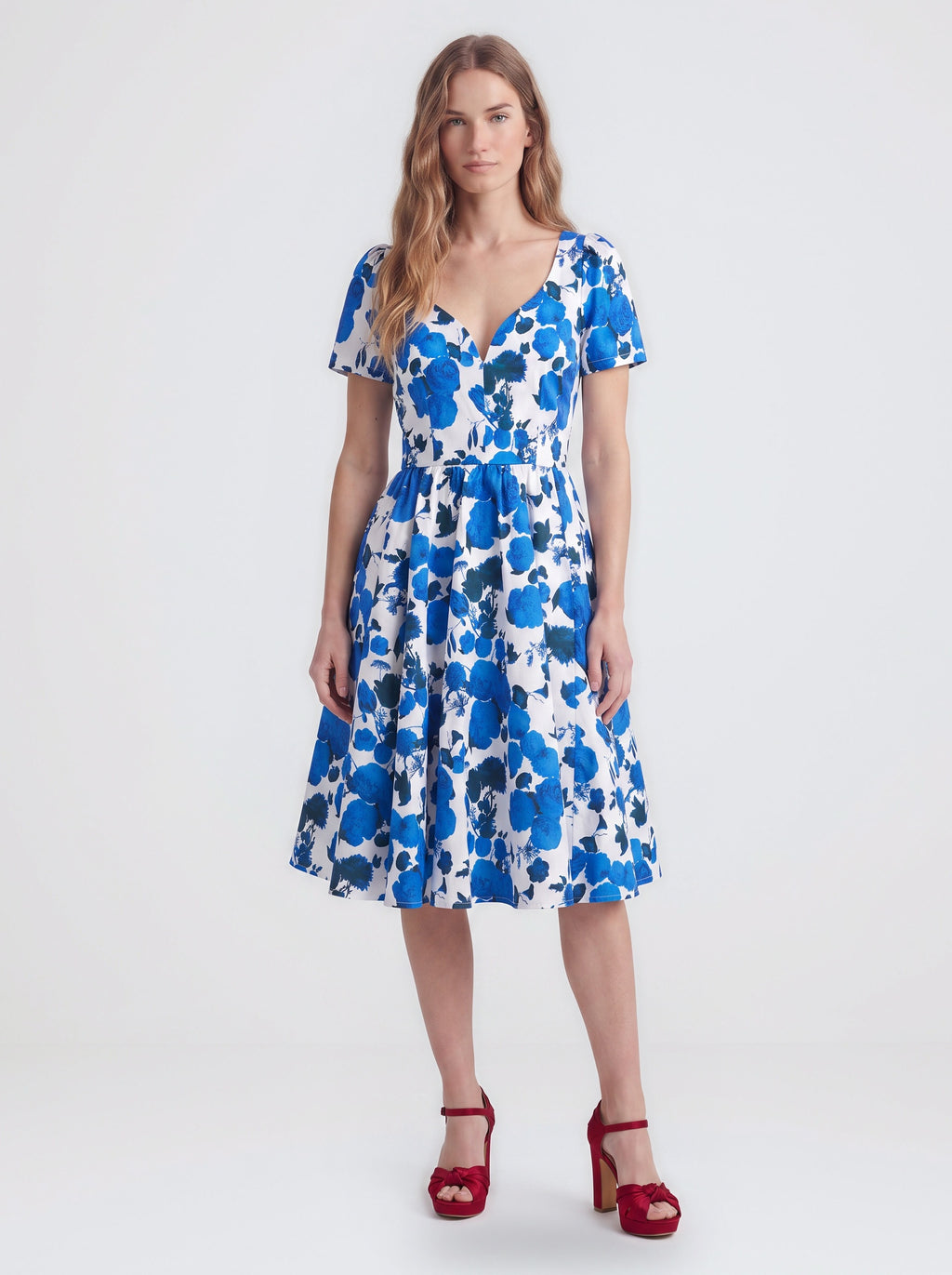 Lilith swing dress in Blue Fiori Dolce, a blue and white painted floral cotton sateen dress with a v neckline and full skirt, by Pinup Girl Clothing