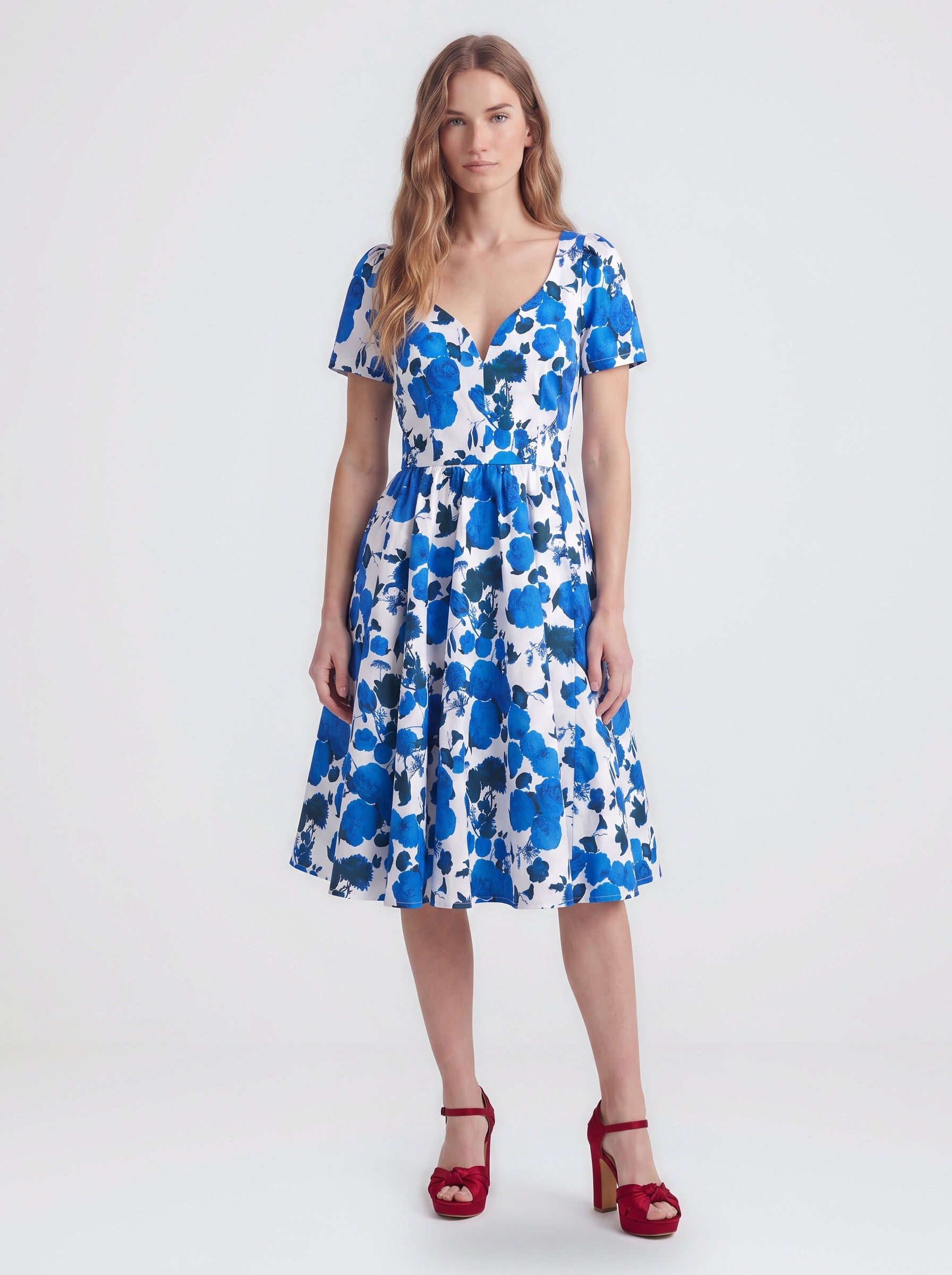 Lilith swing dress in Blue Fiori Dolce, a blue and white painted floral cotton sateen dress with a v neckline and full skirt, by Pinup Girl Clothing