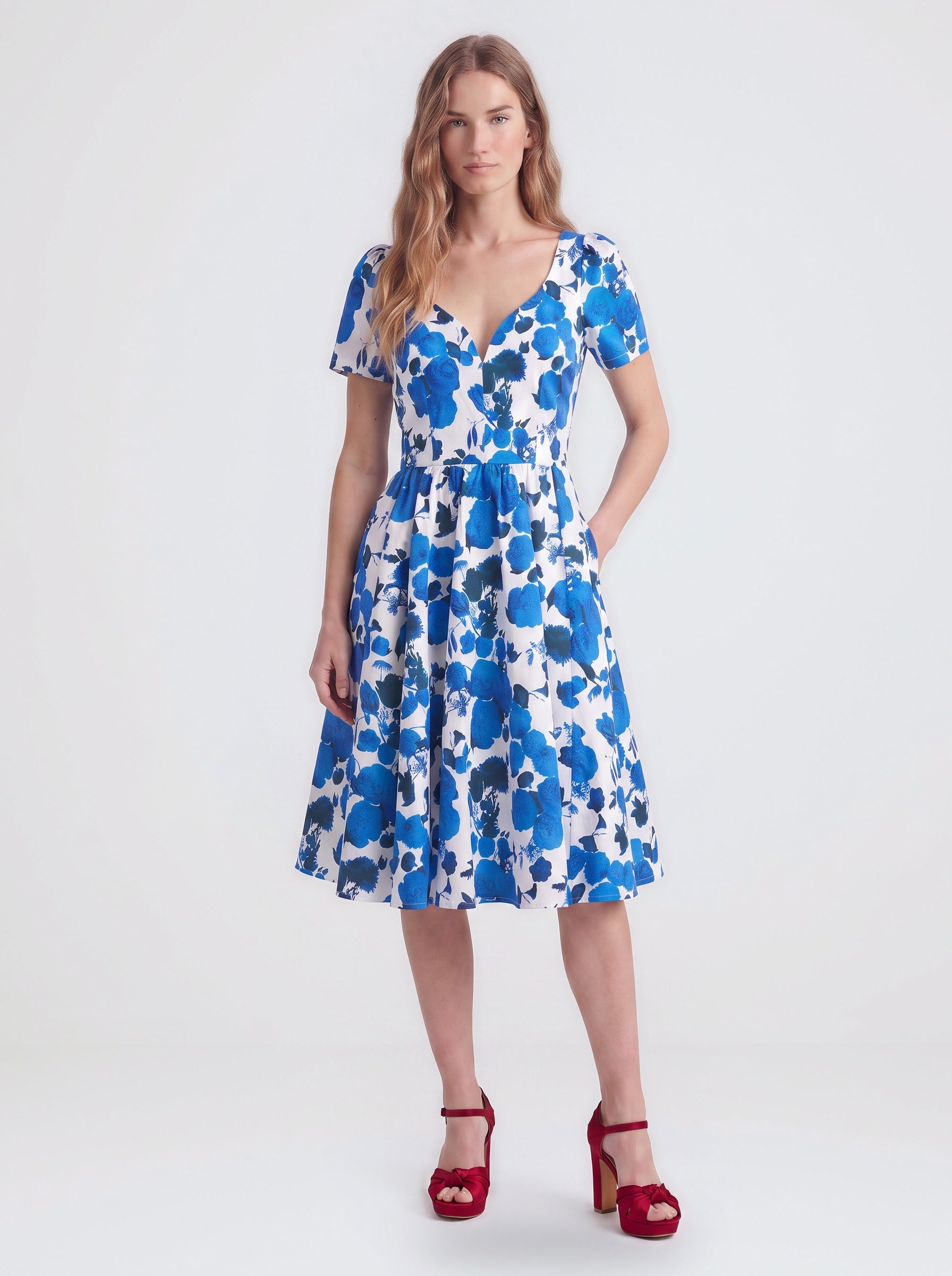 Lilith swing dress in Blue Fiori Dolce, a blue and white painted floral cotton sateen dress with a v neckline and full skirt, by Pinup Girl Clothing